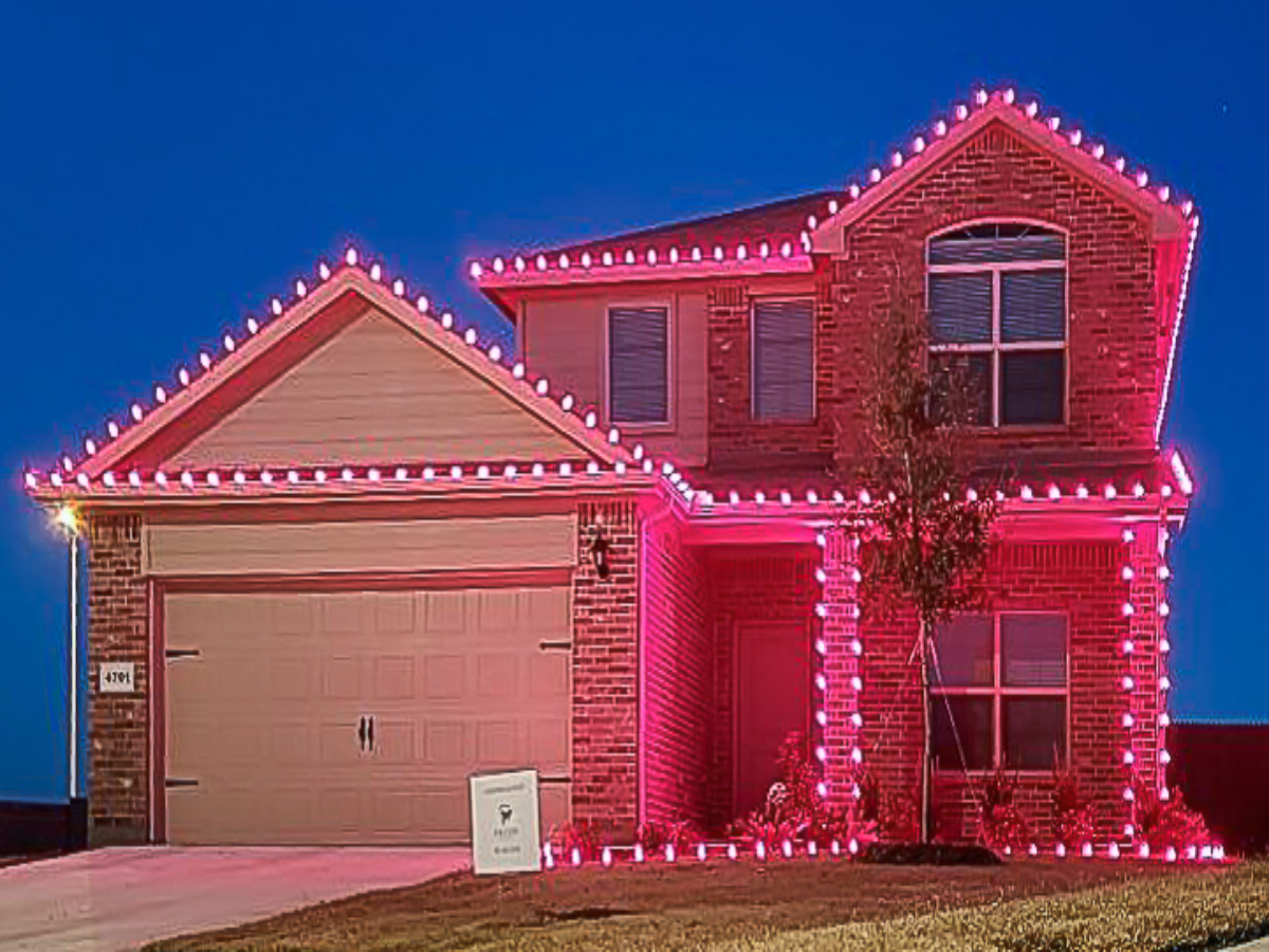 Full home exterior holiday lighting with walkway luminaries